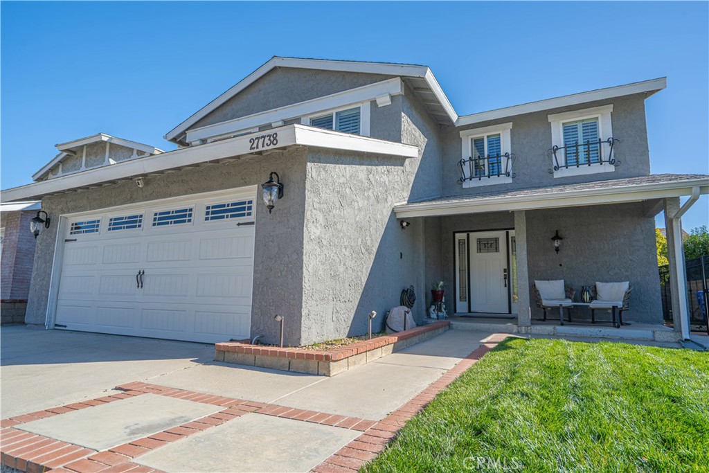 27738 Hyssop Lane Saugus, CA 91350 - Photo 3 of 43 a front view of a house with a yard