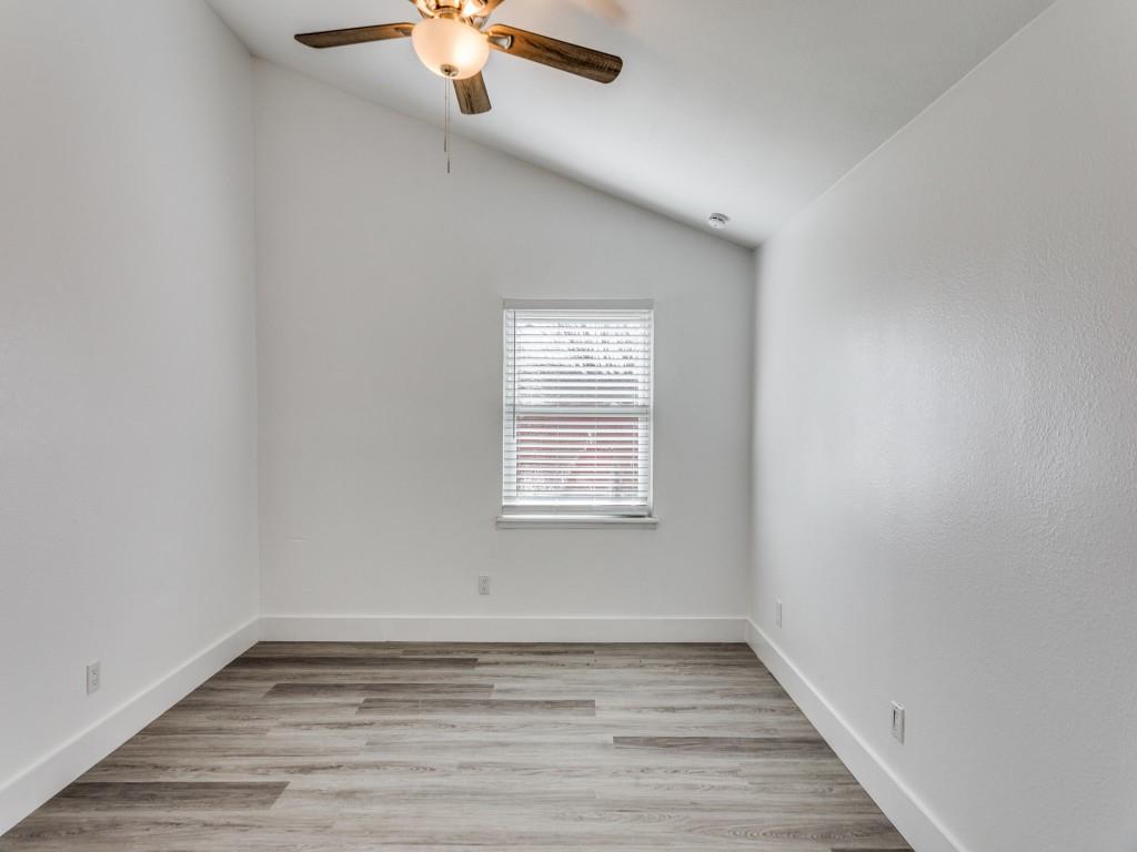 3821 Horizon Place Fort Worth, TX 76133 - Photo 14 of 19 a view of an empty room with wooden floor and a window