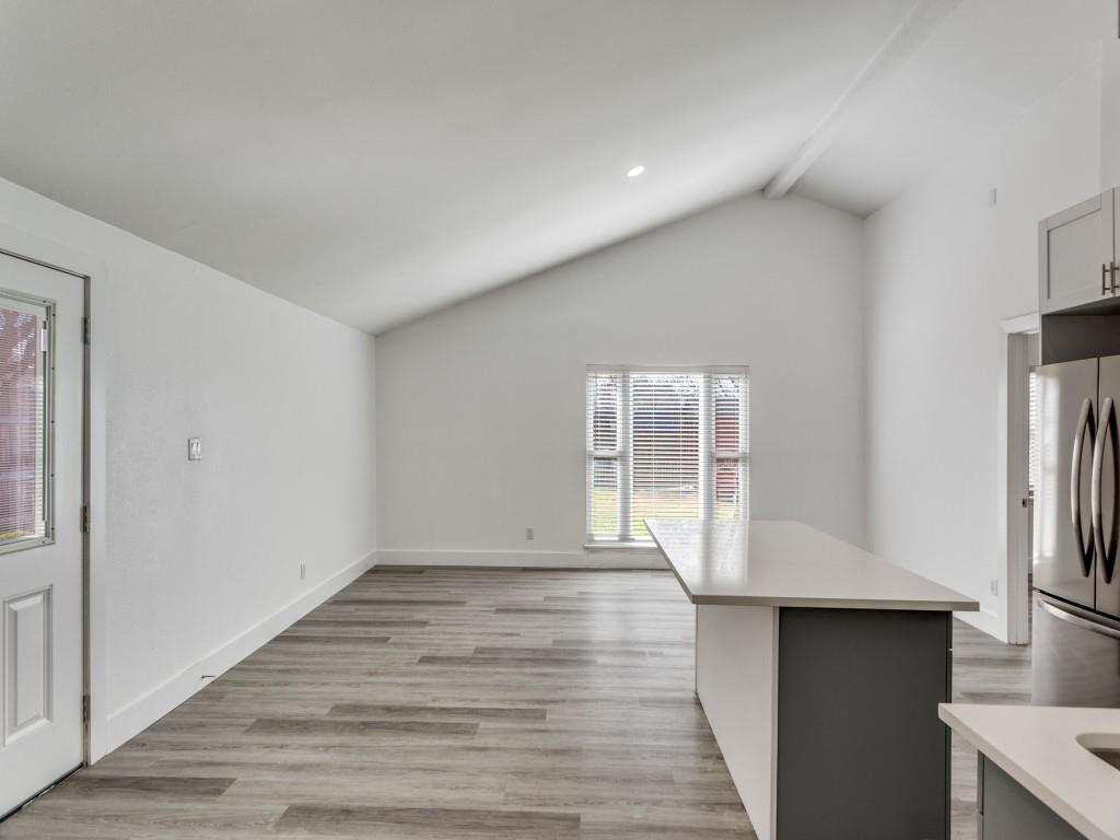 3821 Horizon Place Fort Worth, TX 76133 - Photo 5 of 19 a view of an empty room with wooden floor and a window
