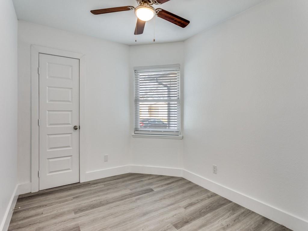 3821 Horizon Place Fort Worth, TX 76133 - Photo 9 of 19 an empty room with wooden floor chandelier fan and windows