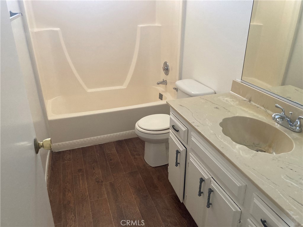 13237 Mohawk Road Apple Valley, CA 92308 - Photo 17 of 21 a bathroom with a sink a toilet and shower
