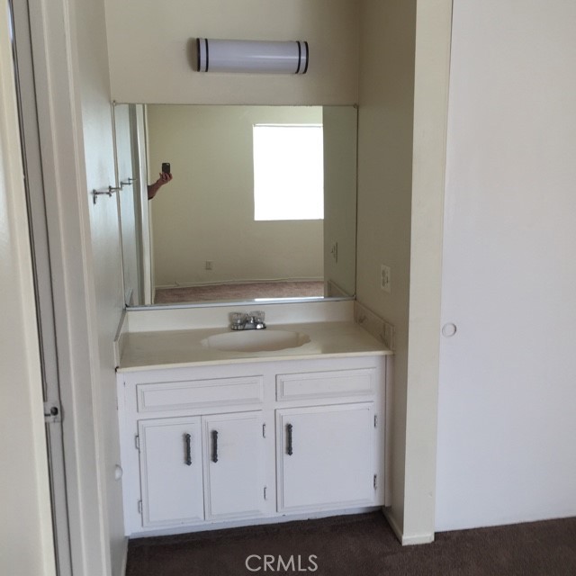 13237 Mohawk Road Apple Valley, CA 92308 - Photo 7 of 21 a bathroom with a sink and a mirror