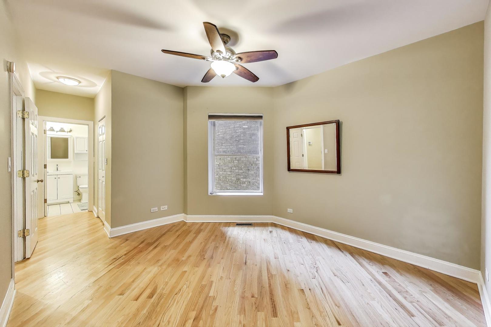 7730 North Paulina Street, Unit 1 Chicago, IL 60626 - Photo 24 of 59 a view of empty room with wooden floor
