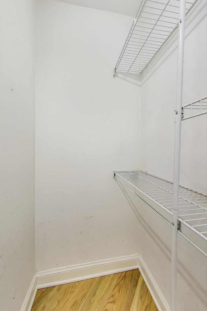 7730 North Paulina Street, Unit 1 Chicago, IL 60626 - Photo 27 of 59 a view of a room with racks on the wall