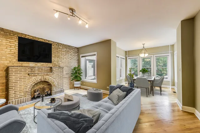 a living room with furniture fireplace and a flat screen tv