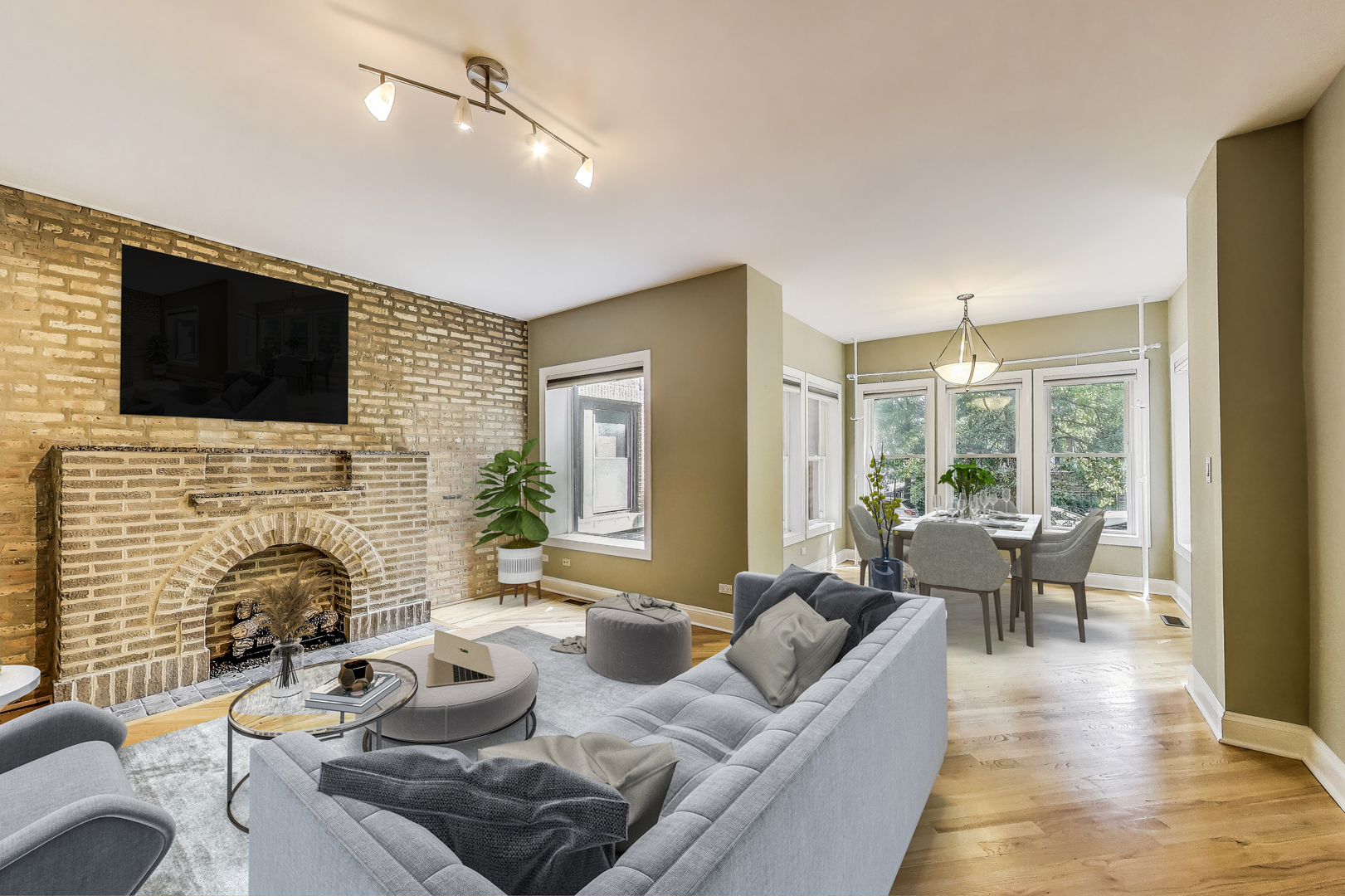7730 North Paulina Street, Unit 1 Chicago, IL 60626 - Photo 3 of 59 a living room with furniture fireplace and a flat screen tv