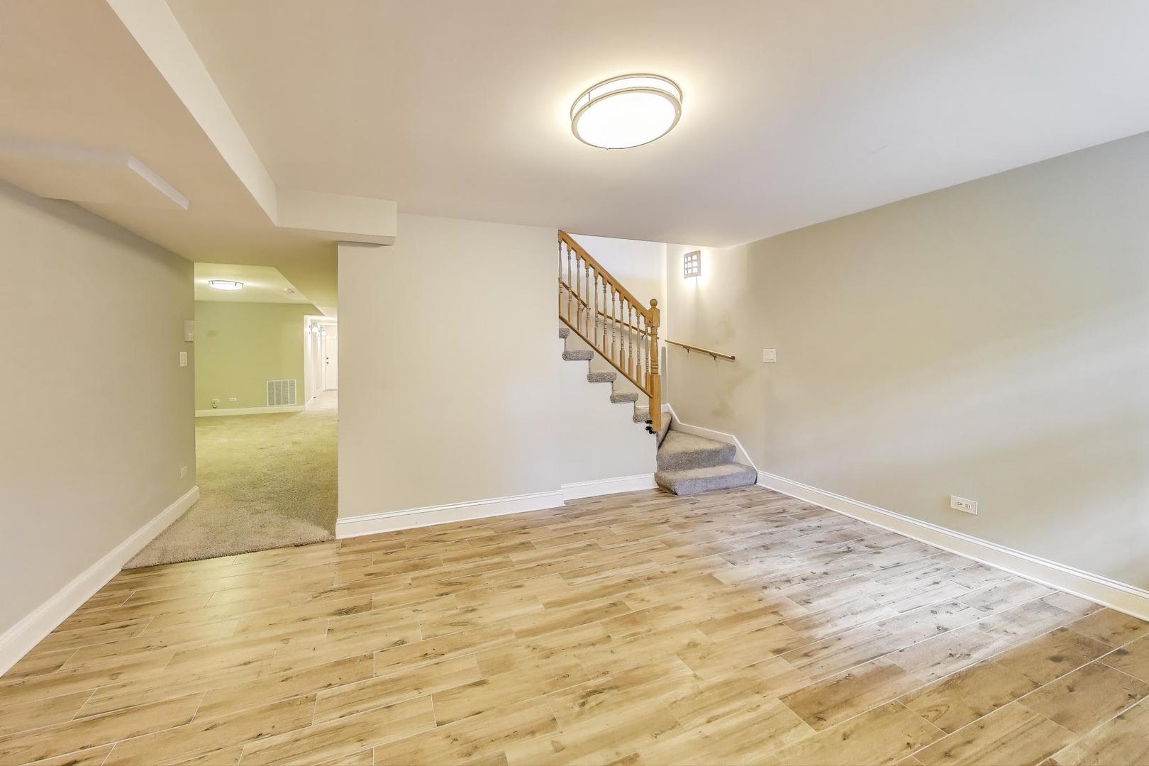 7730 North Paulina Street, Unit 1 Chicago, IL 60626 - Photo 34 of 59 a view of an empty room with wooden floor