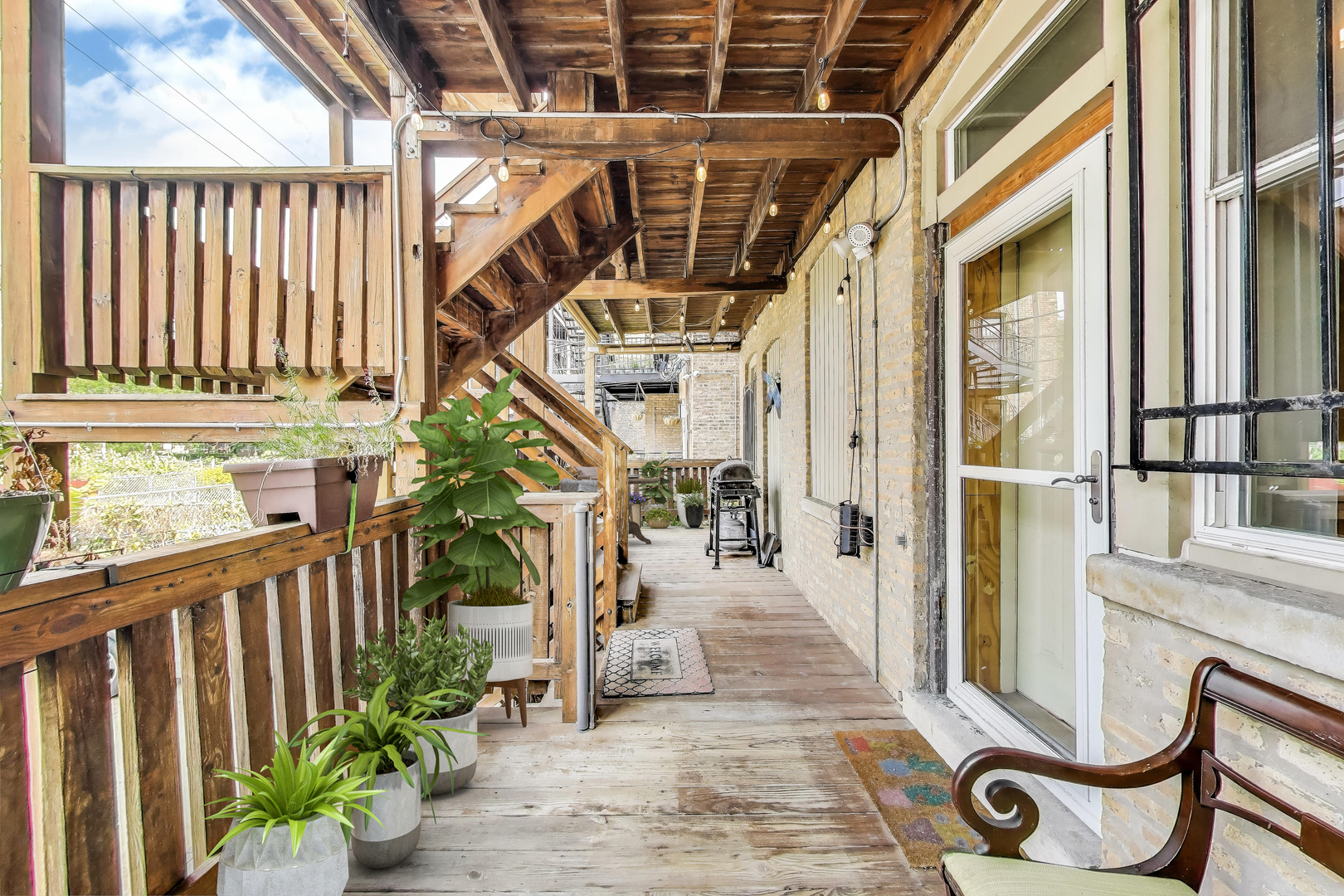 7730 North Paulina Street, Unit 1 Chicago, IL 60626 - Photo 50 of 59 a view of entryway with wooden floor and a potted plant
