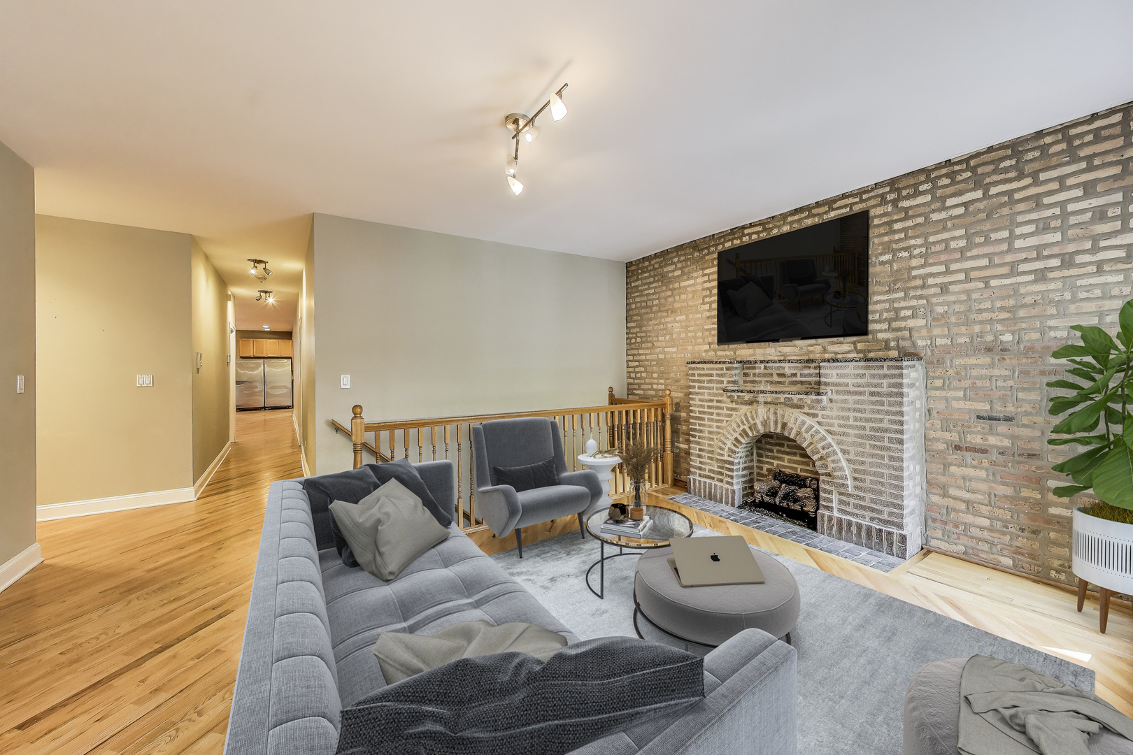 7730 North Paulina Street, Unit 1 Chicago, IL 60626 - Photo 5 of 59 a living room with furniture a fireplace and a flat screen tv