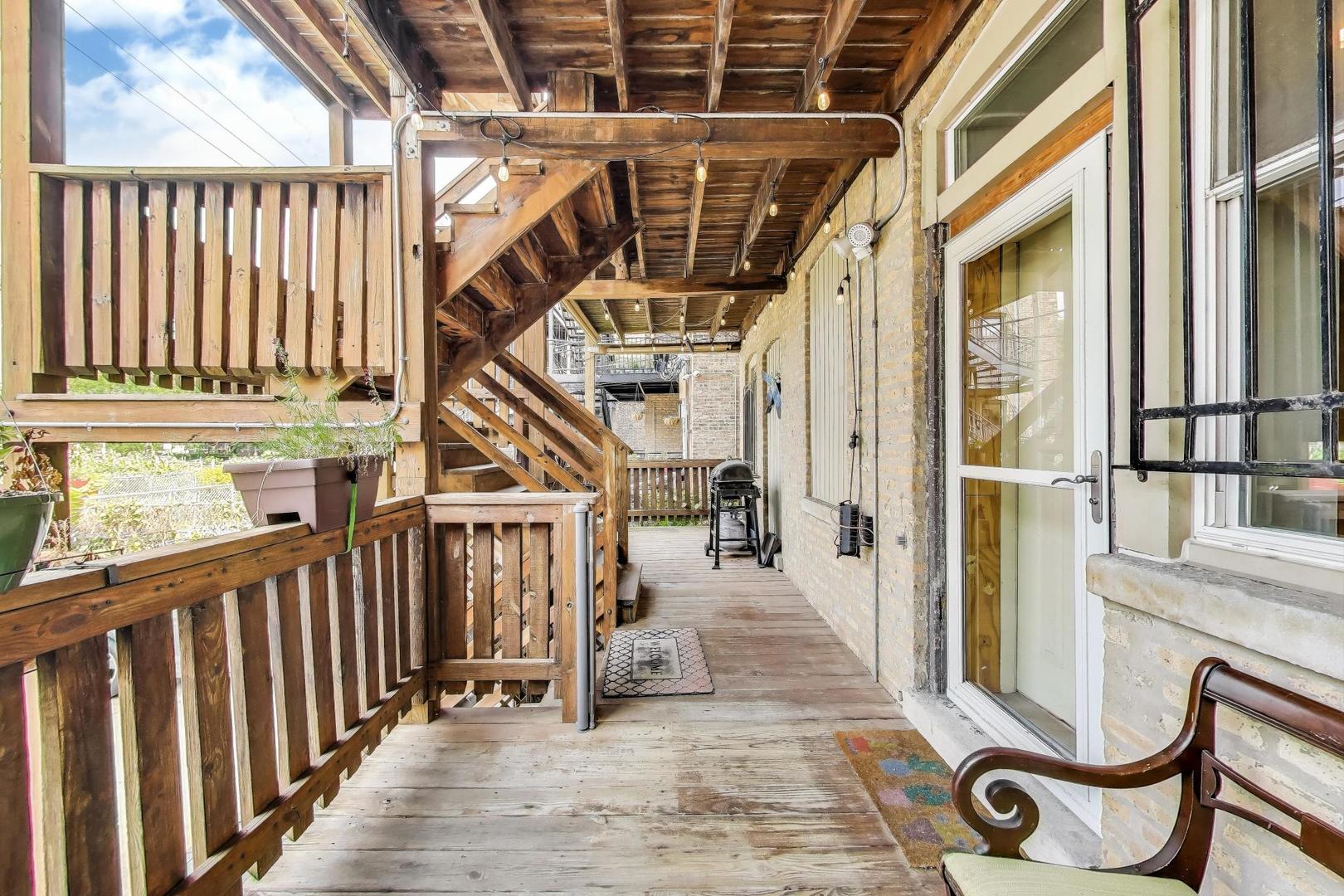 7730 North Paulina Street, Unit 1 Chicago, IL 60626 - Photo 51 of 59 a view of entryway with wooden floor and fence