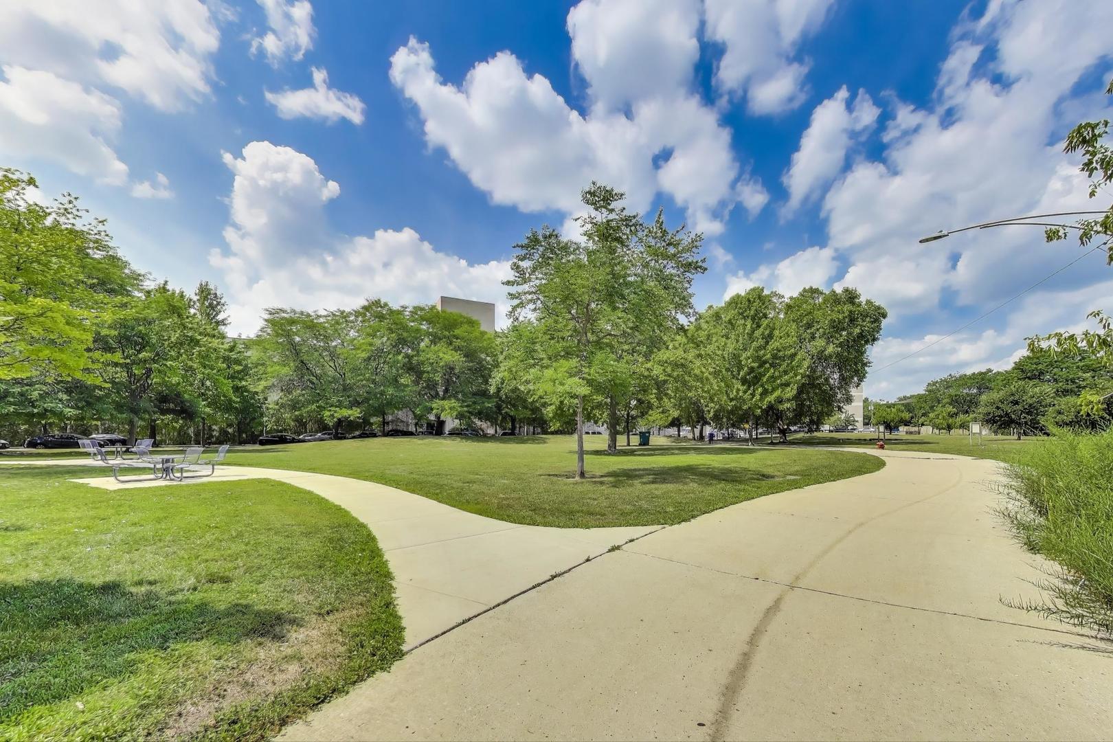 7730 North Paulina Street, Unit 1 Chicago, IL 60626 - Photo 55 of 59 a view of a golf course with a lake view
