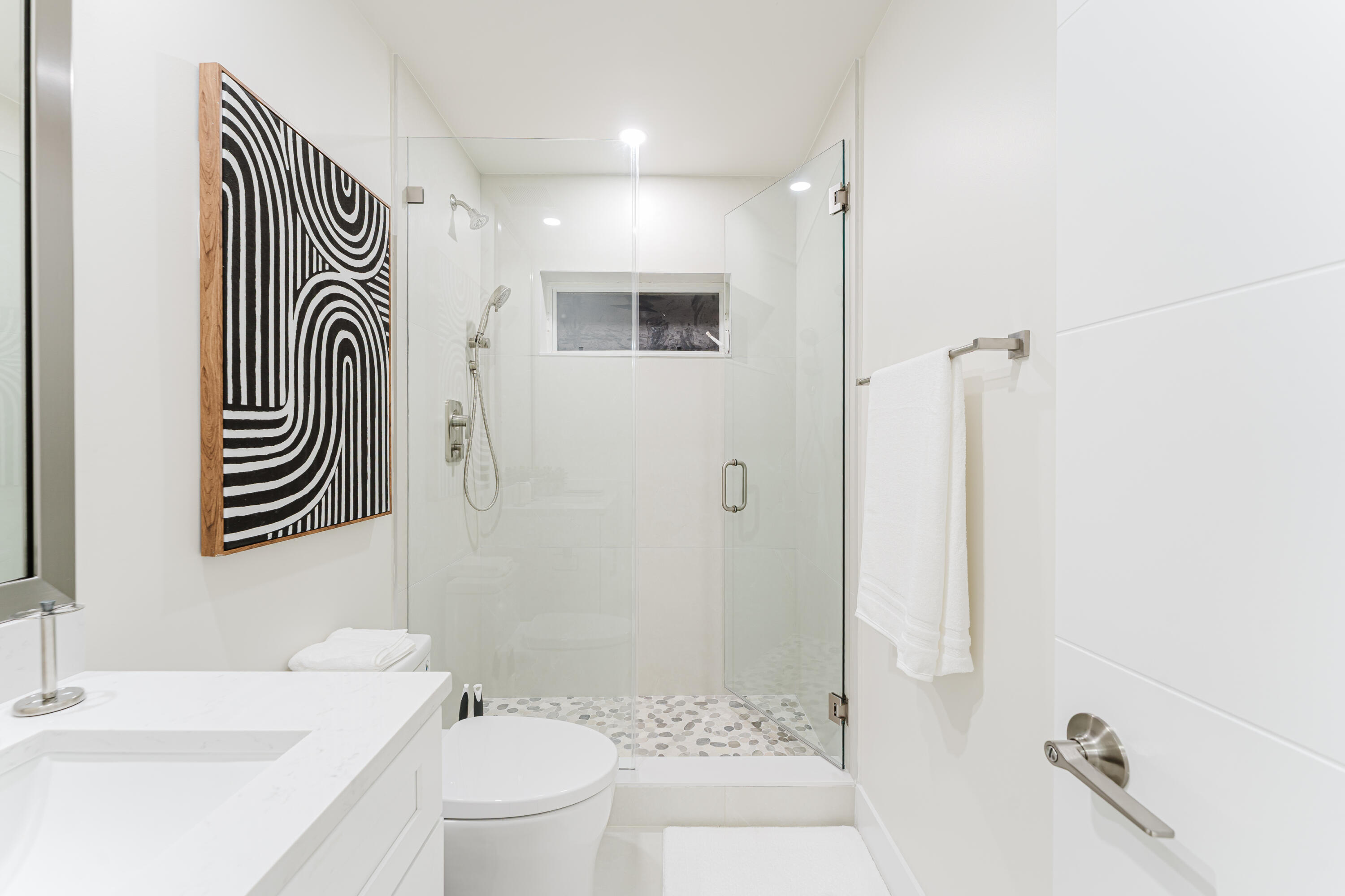 3199 Northeast 6th Drive Boca Raton, FL 33431 - Photo 47 of 49 a bathroom with a sink a toilet and shower