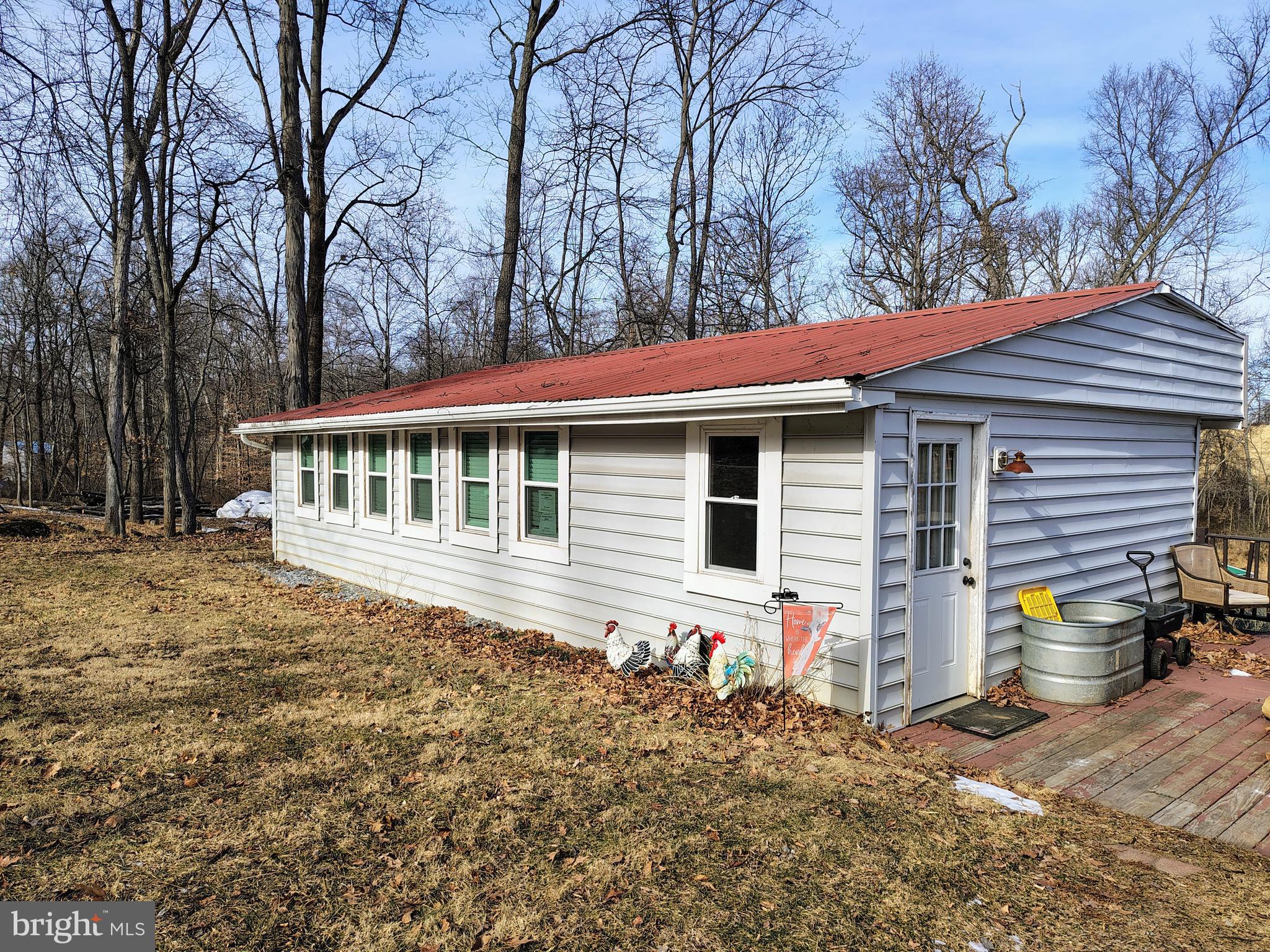 8065 Bull Road Lewisberry, PA 17339 - Photo 1 of 21 a front view of house with yard and trees around