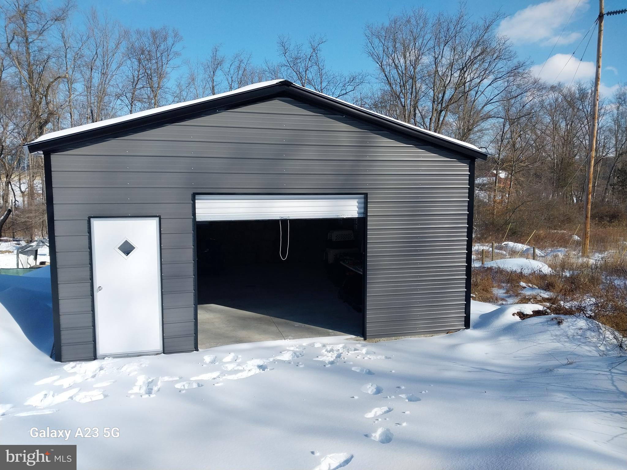 8065 Bull Road Lewisberry, PA 17339 - Photo 12 of 21 a front view of a house with a yard and garage