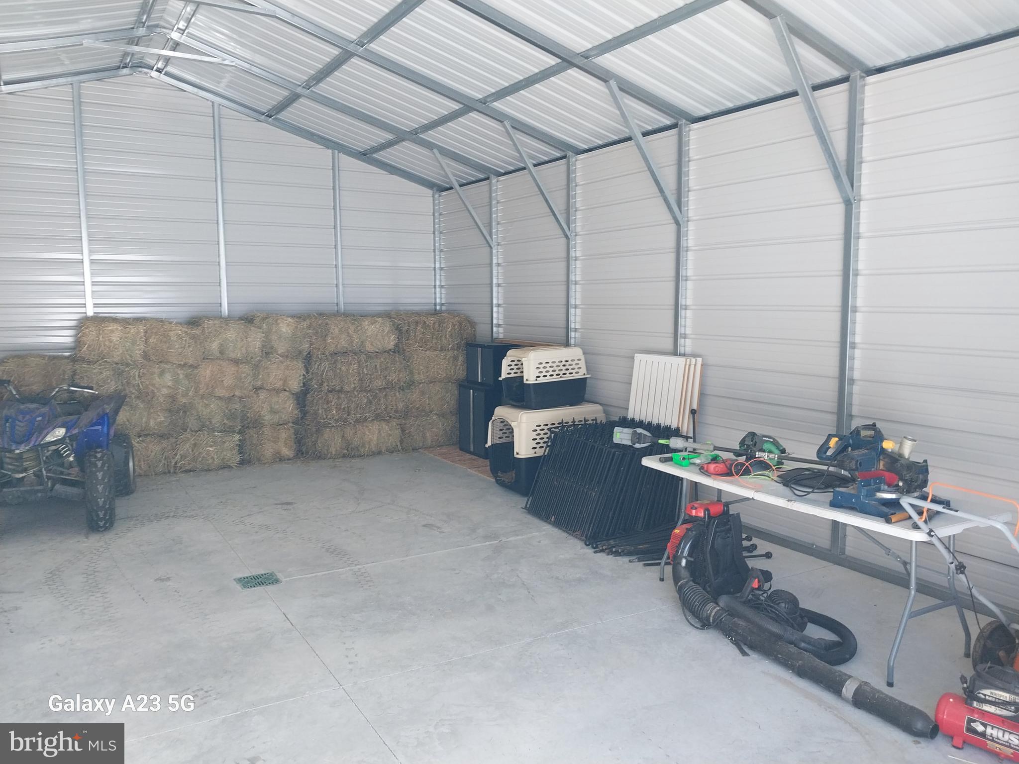 8065 Bull Road Lewisberry, PA 17339 - Photo 13 of 21 a room with water heater and racks on the wall