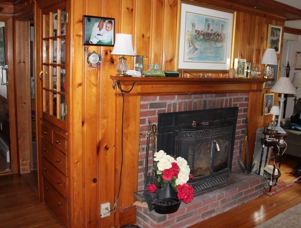 189 Tahanto Road Bourne, MA 02559 - Photo 8 of 24 a living room with furniture and a fireplace