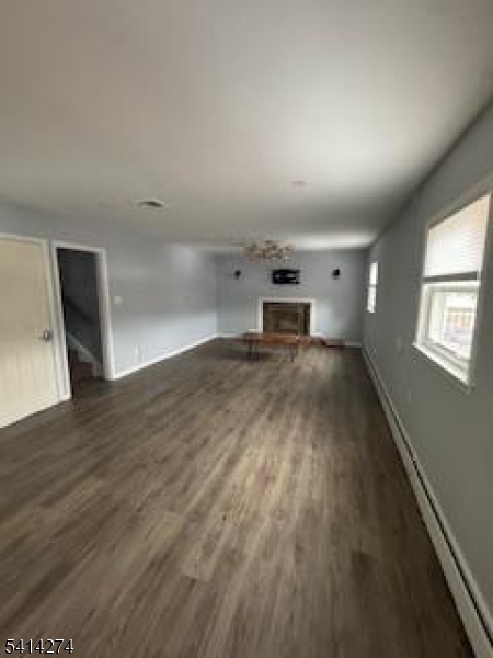 11 Main Street Sparta, NJ 07871 - Photo 5 of 10 an empty room with wooden floor and windows