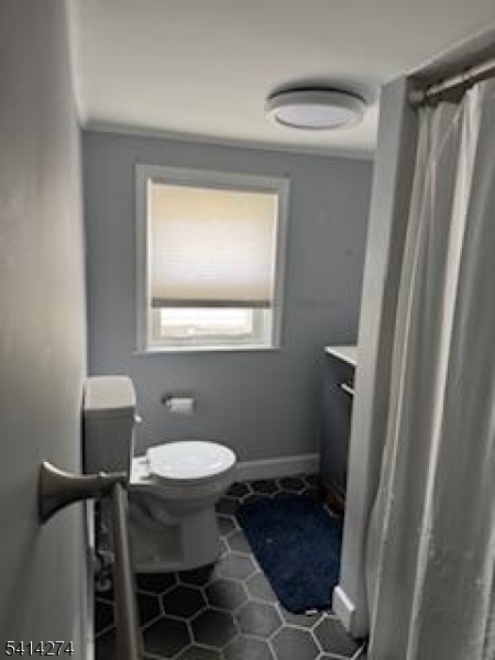 11 Main Street Sparta, NJ 07871 - Photo 6 of 10 a bathroom with a toilet and a mirror