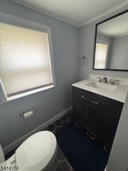 11 Main Street Sparta, NJ 07871 - Photo 7 of 10 a bathroom with a toilet sink vanity and mirror