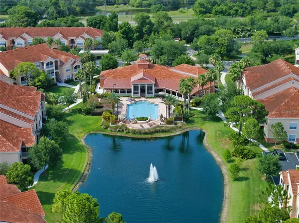an aerial view of a house with yard swimming pool and outdoor seating