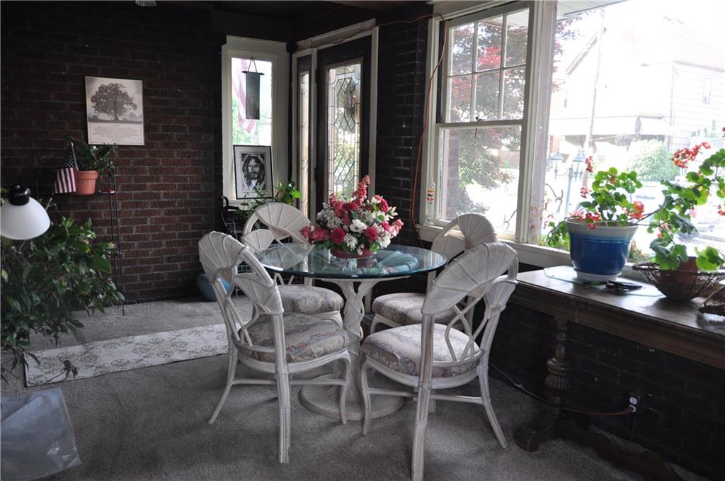 402 Vermont Avenue Rochester, PA 15074 - Photo 3 of 24 Upon entering the front door, you are welcomed by this charming enclosed sunroom a great place for your morning coffee or a good read!