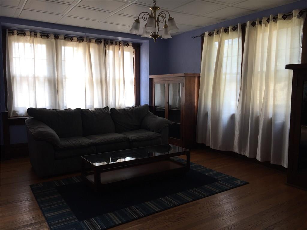 402 Vermont Avenue Rochester, PA 15074 - Photo 4 of 24 Beautiful hardwood, two built in's and window bench in your living room.