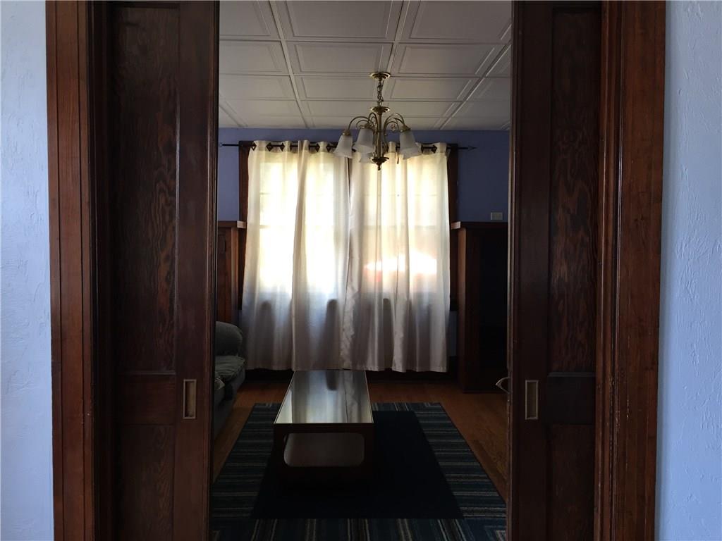 402 Vermont Avenue Rochester, PA 15074 - Photo 9 of 24 Pocket doors view from dining room to living room.