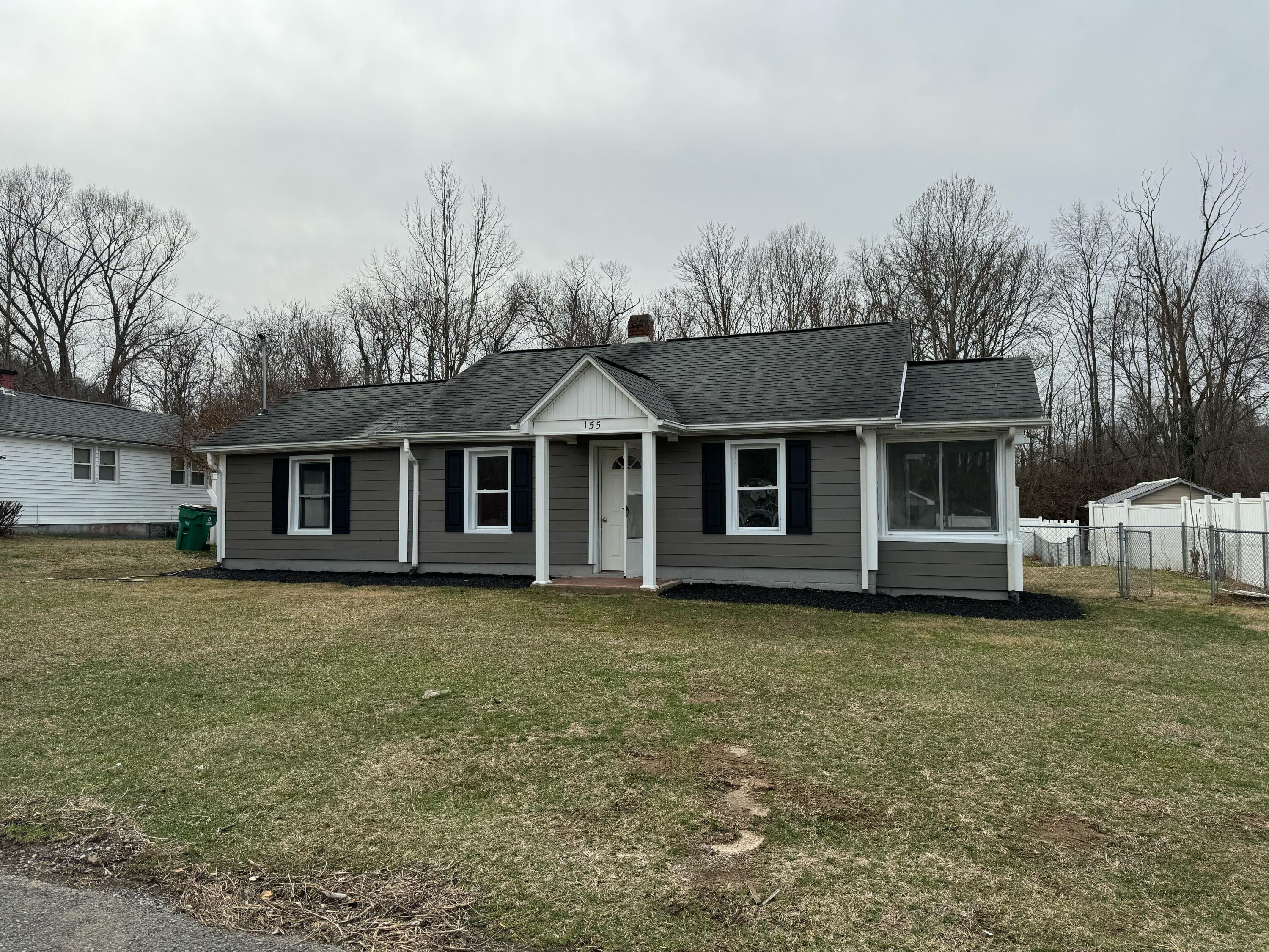 155 Brake Road Elliston, VA 24087 - Photo 1 of 19 a front view of a house with a garden