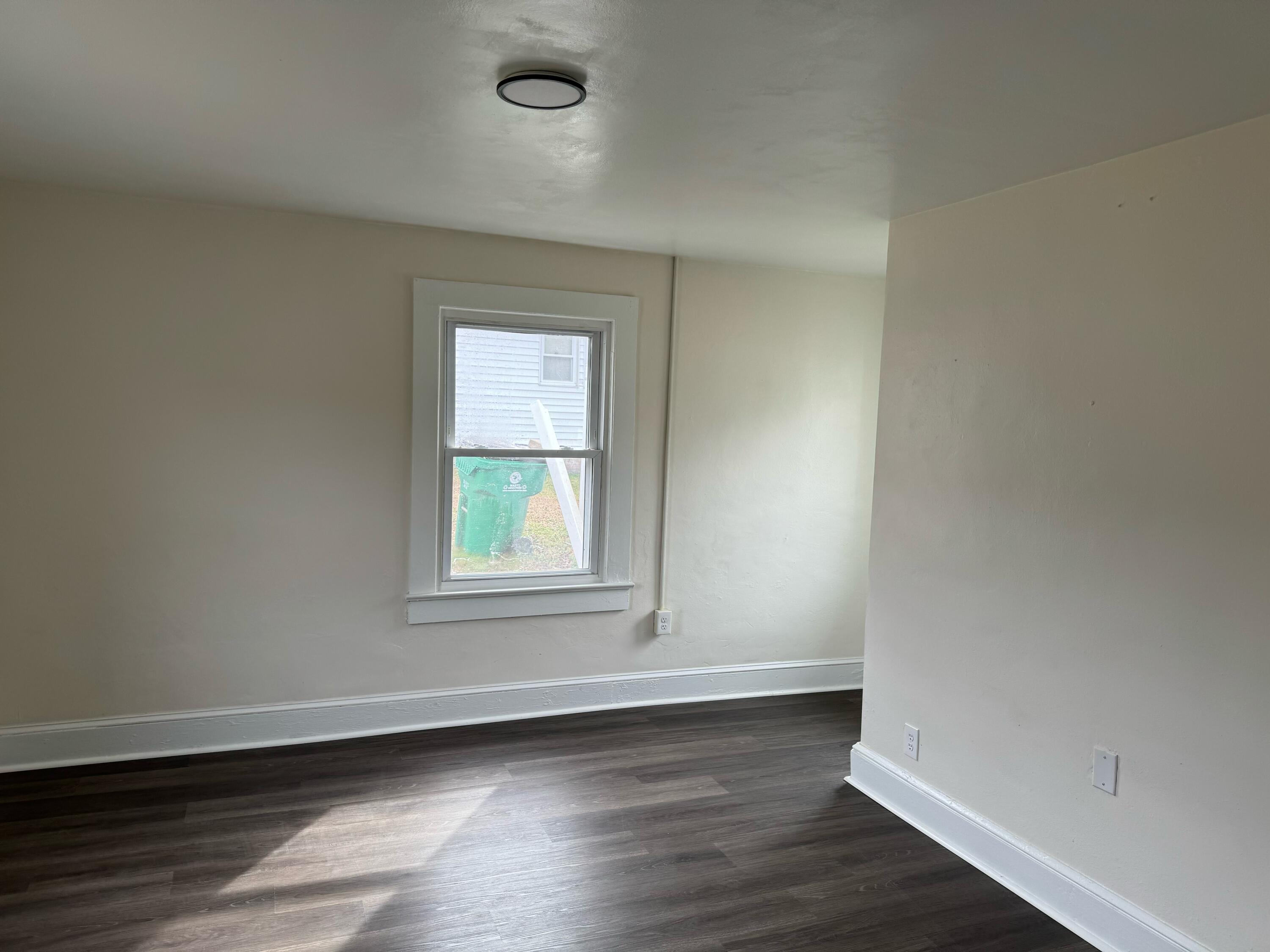 155 Brake Road Elliston, VA 24087 - Photo 12 of 19 an empty room with wooden floor and windows