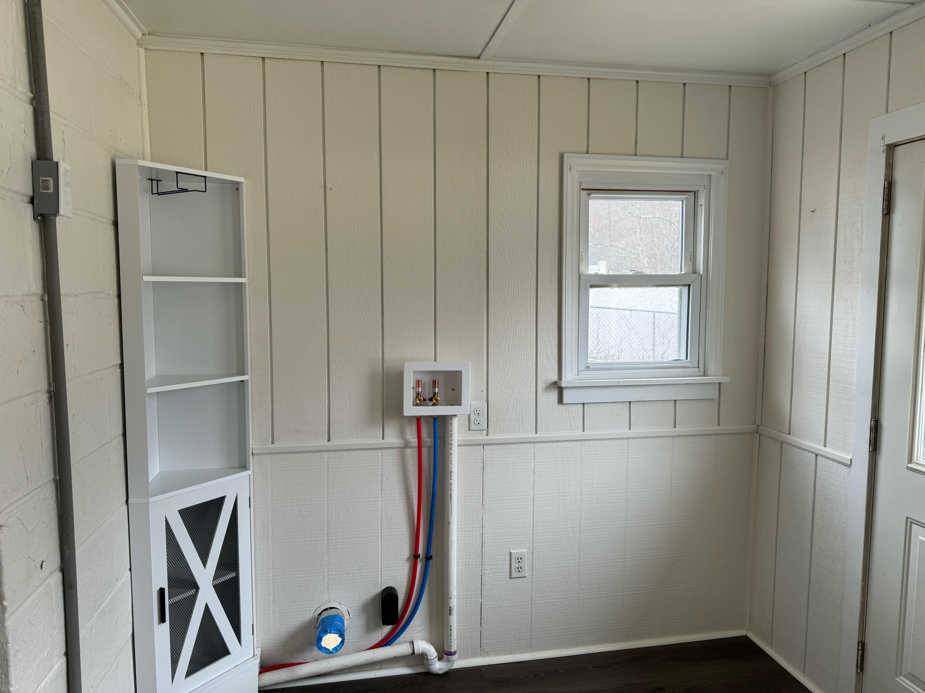 155 Brake Road Elliston, VA 24087 - Photo 8 of 19 a view of an empty room with wooden floor and a window