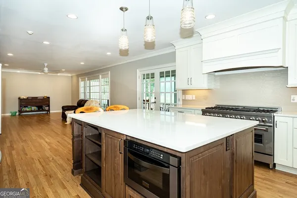 a kitchen with a stove and a table