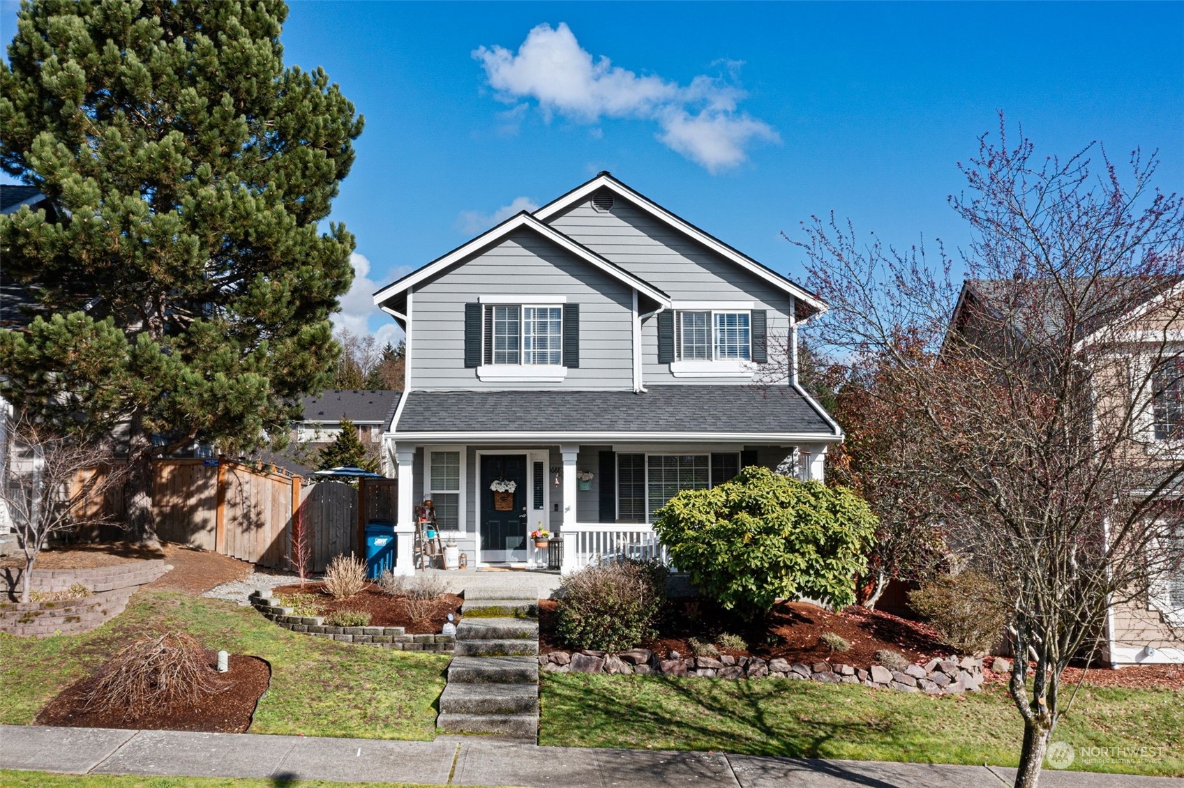 a front view of a house with garden