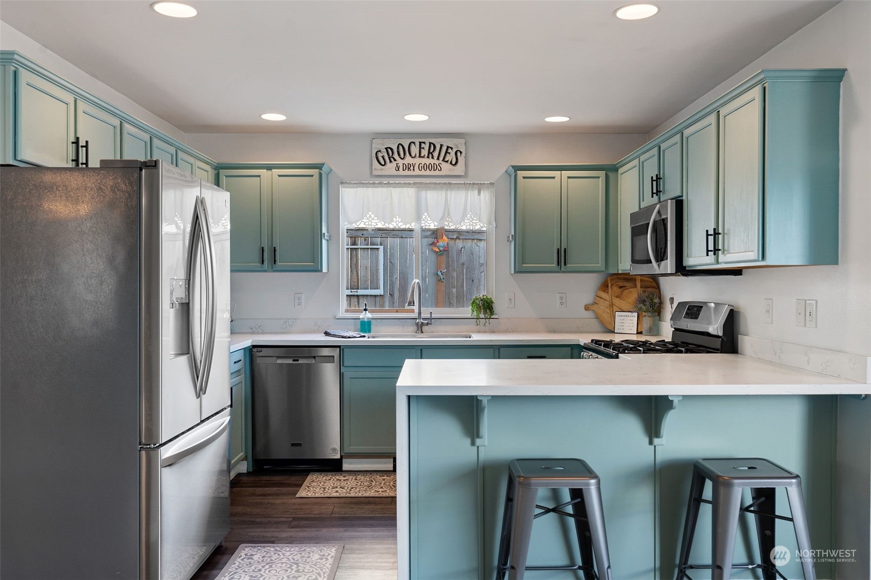 16887 Copper Mountain Road Southeast Monroe, WA 98272 - Photo 12 of 34 a kitchen with stainless steel appliances granite countertop a refrigerator and a sink