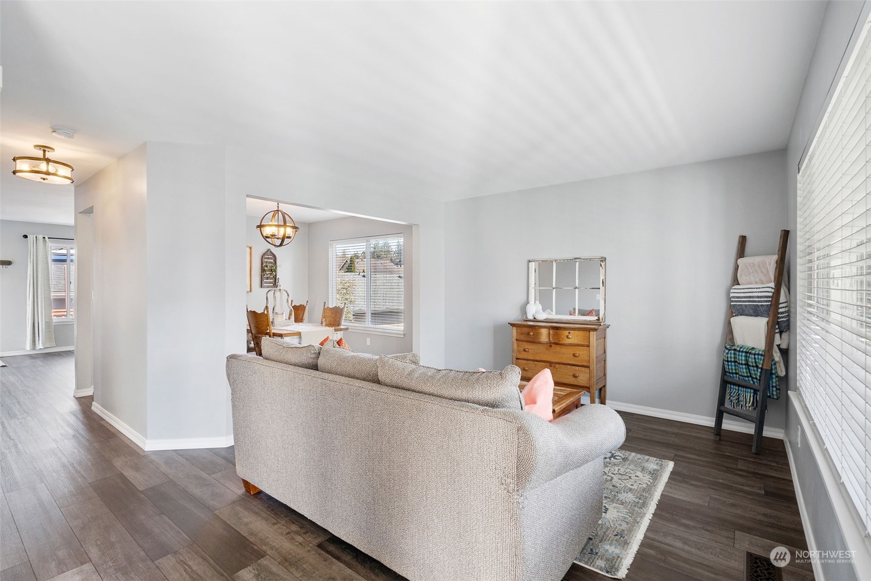 16887 Copper Mountain Road Southeast Monroe, WA 98272 - Photo 4 of 34 a living room with furniture and a wooden floor
