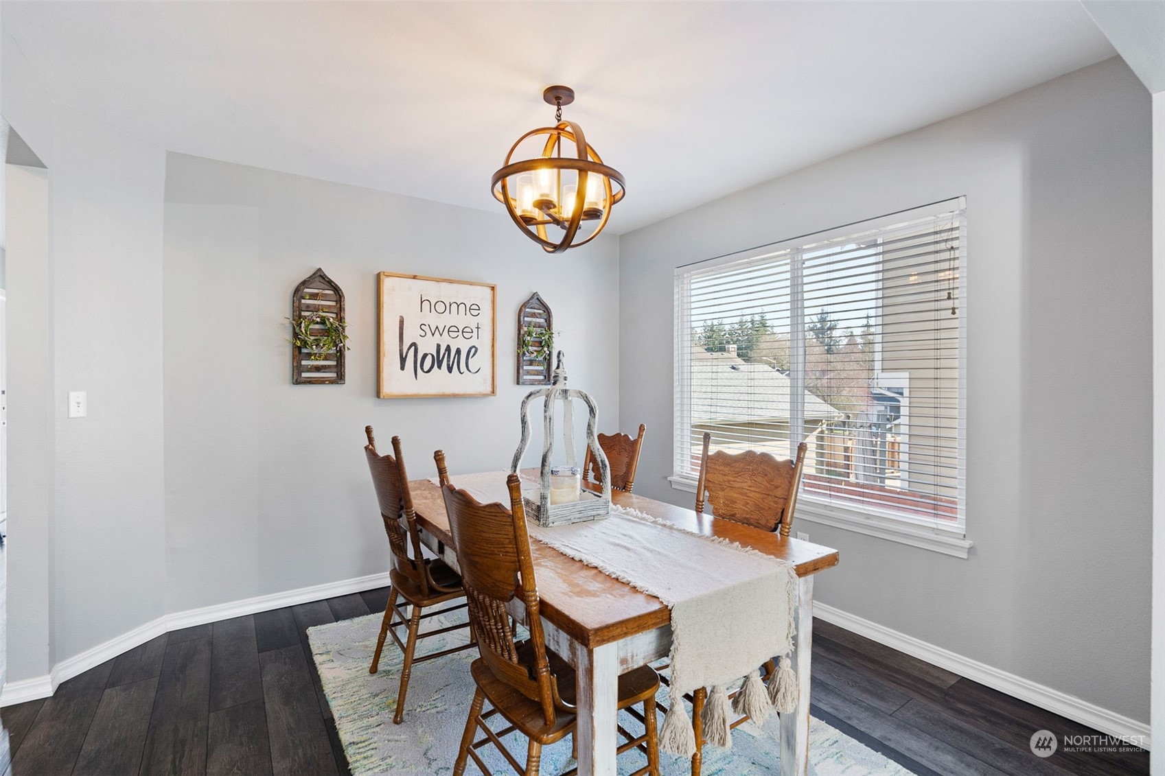 16887 Copper Mountain Road Southeast Monroe, WA 98272 - Photo 7 of 34 a view of a dining room with furniture window and wooden floor