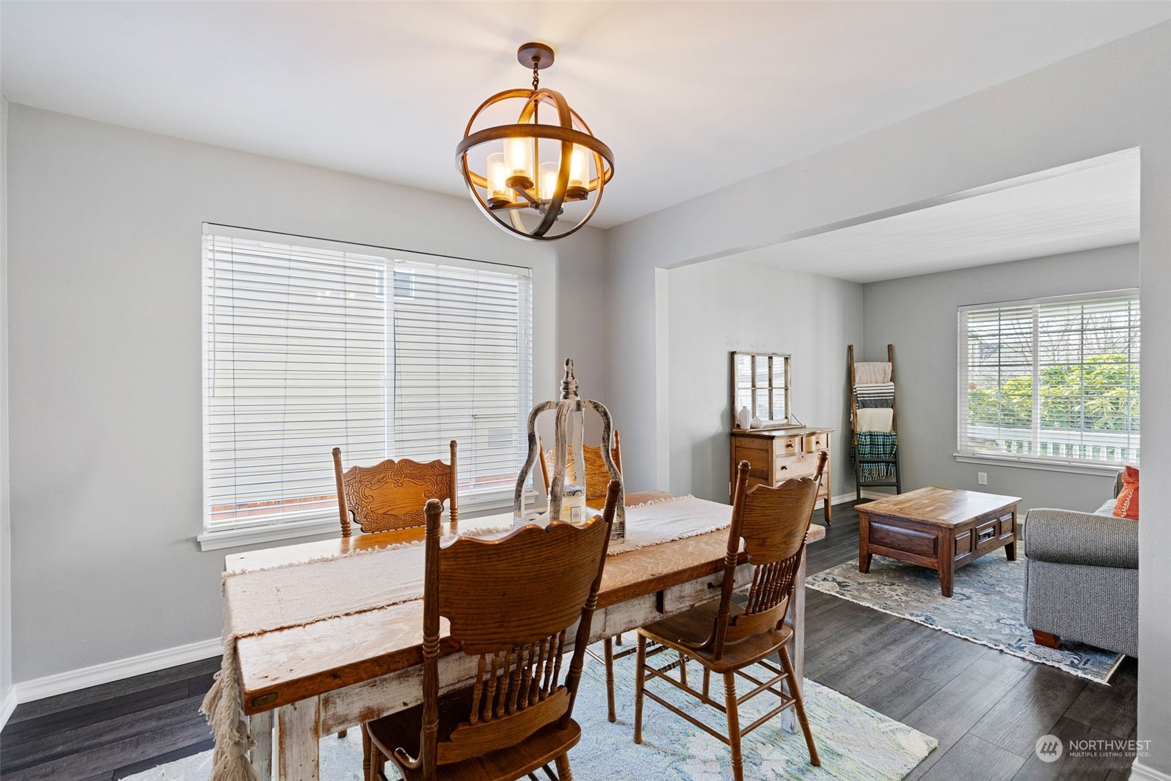 16887 Copper Mountain Road Southeast Monroe, WA 98272 - Photo 8 of 34 a view of a dining room with furniture window and wooden floor