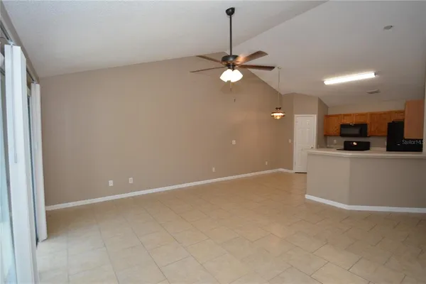 a view of a kitchen with a stove cabinets and wooden floor