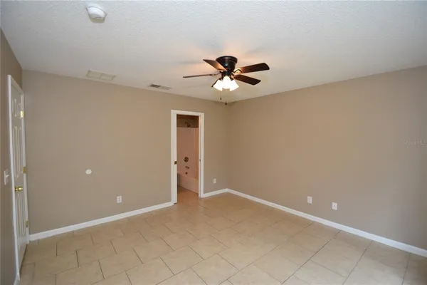 a white toilet sitting next to a bathroom sink and tub