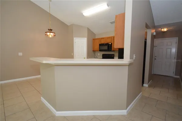 a kitchen with cabinets and stainless steel appliances