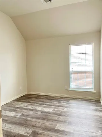 a view of a room that has a window in it