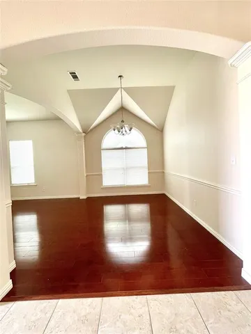 a view of a hallway with windows
