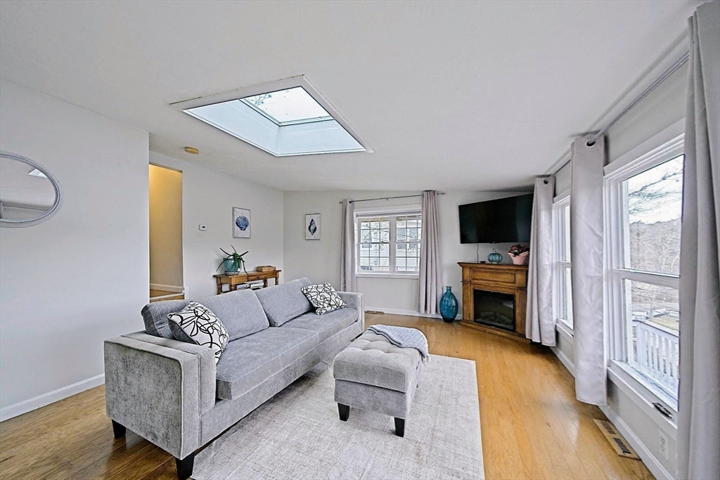 21 Hillside Road Plymouth, MA 02360 - Photo 20 of 39 a living room with furniture and a flat screen tv