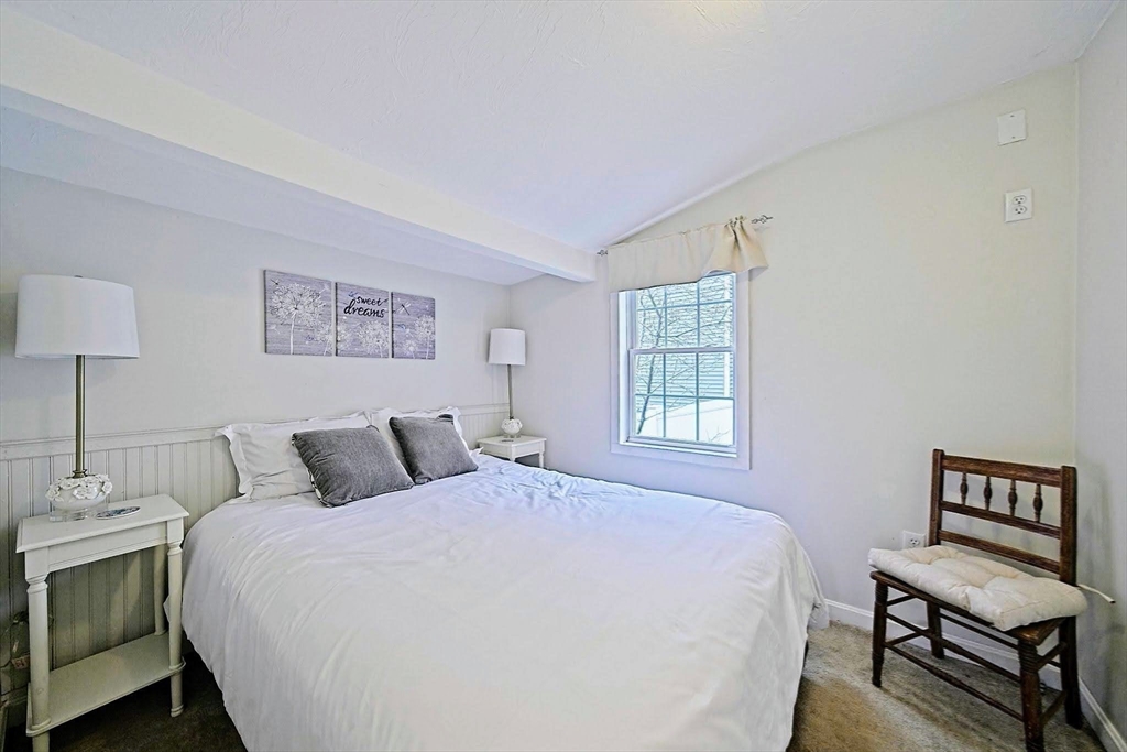 21 Hillside Road Plymouth, MA 02360 - Photo 24 of 39 a bedroom with a bed and a dresser with rug