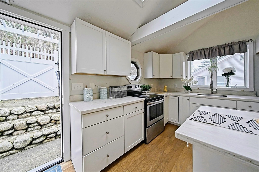 21 Hillside Road Plymouth, MA 02360 - Photo 26 of 39 a kitchen with a sink stove and cabinets