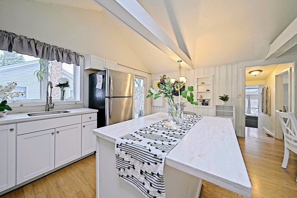 21 Hillside Road Plymouth, MA 02360 - Photo 27 of 39 a large kitchen with a table and refrigerator