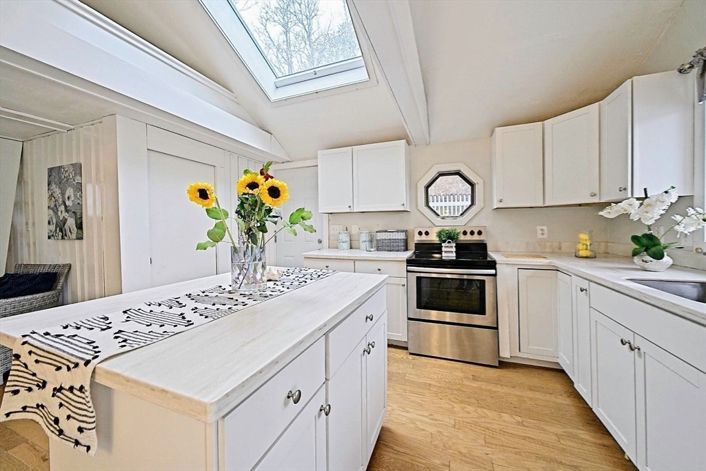 21 Hillside Road Plymouth, MA 02360 - Photo 29 of 39 a kitchen with stainless steel appliances granite countertop a sink and cabinets