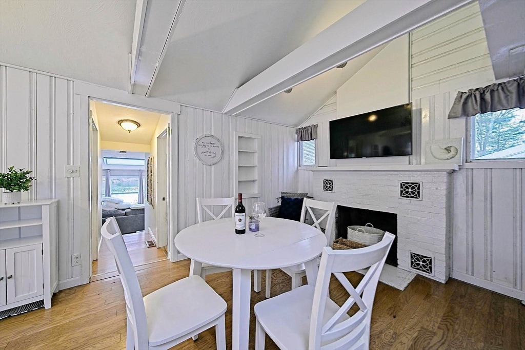 21 Hillside Road Plymouth, MA 02360 - Photo 32 of 39 a view of a dining room with furniture window and wooden floor