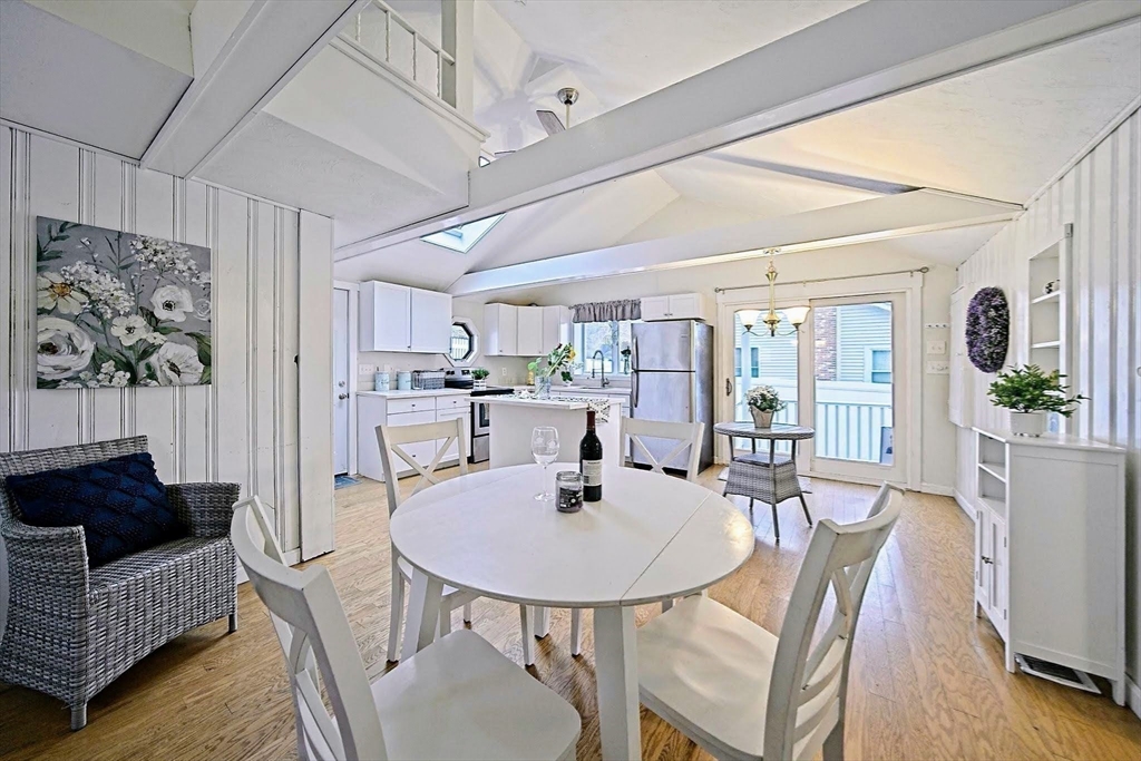 21 Hillside Road Plymouth, MA 02360 - Photo 33 of 39 a view of a dining room with furniture and wooden floor