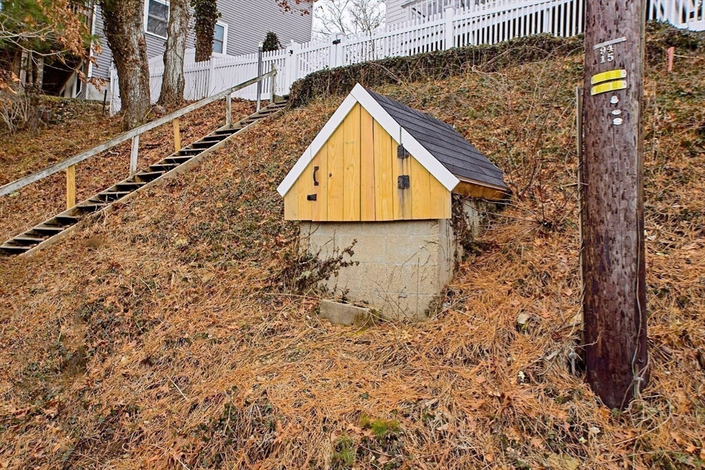 21 Hillside Road Plymouth, MA 02360 - Photo 37 of 39 a view of a wooden wall with a dry yard