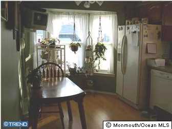 8A Mill Road, Unit B Whiting, NJ 08759 - Photo 3 of 3 a dining room with furniture and window